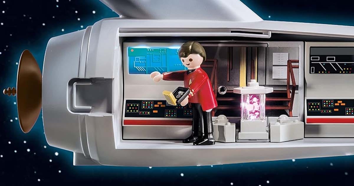 This close up shows a Playmobil character inside of the toy Enterprise.