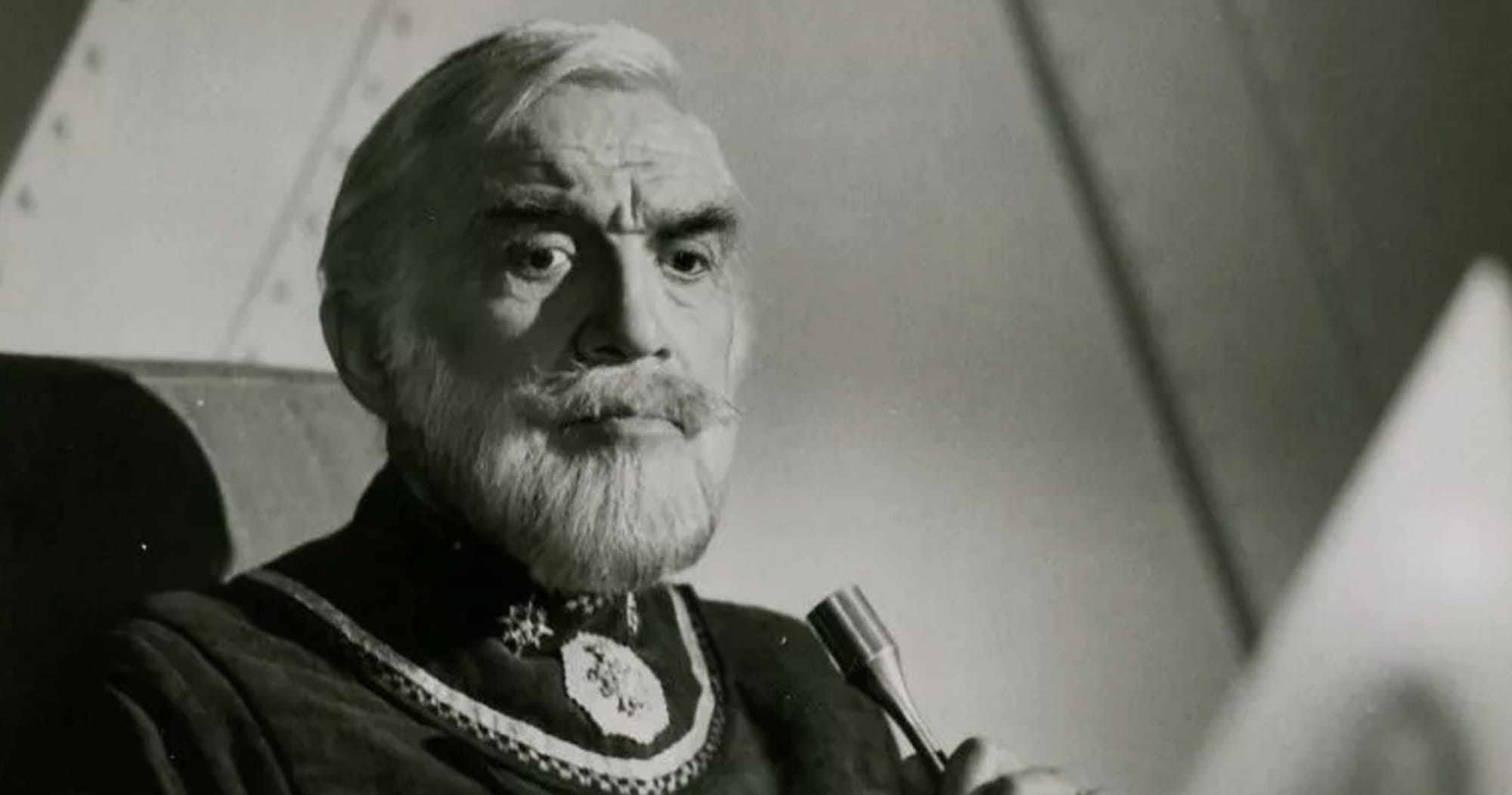 A black and white image of Lorne Greene as Adama from Battlestar Galactica.