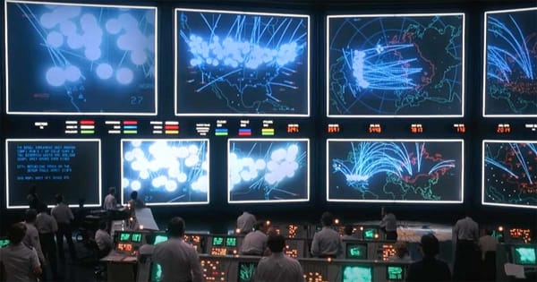 Command center with screens showing nuclear strike simulations in the movie WarGames.